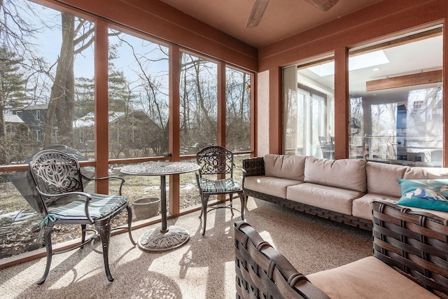 sunroom featuring ceiling fan