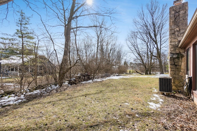 snowy yard with central AC unit