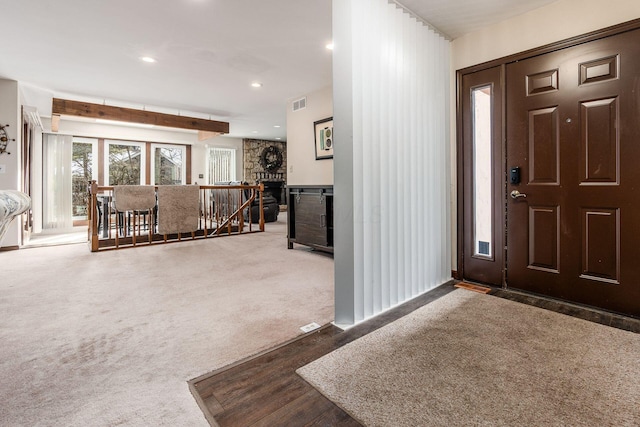 carpeted entryway featuring recessed lighting and visible vents