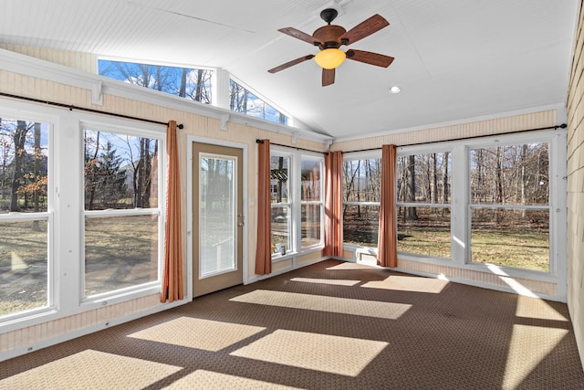 unfurnished sunroom featuring lofted ceiling and a ceiling fan