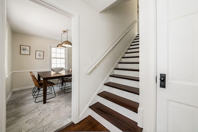 stairs featuring baseboards