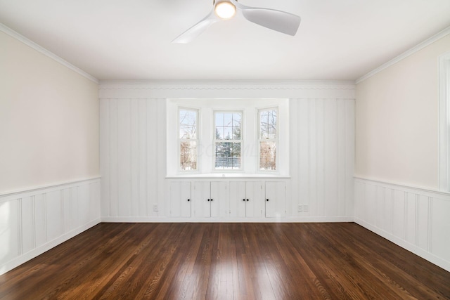 unfurnished room featuring dark wood-style floors, ceiling fan, and crown molding