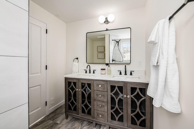 bathroom with double vanity and a sink