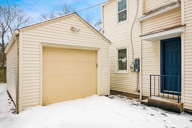 view of snow covered garage