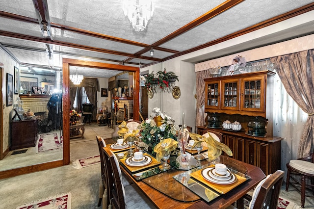 dining area with a chandelier, a fireplace, and a textured ceiling