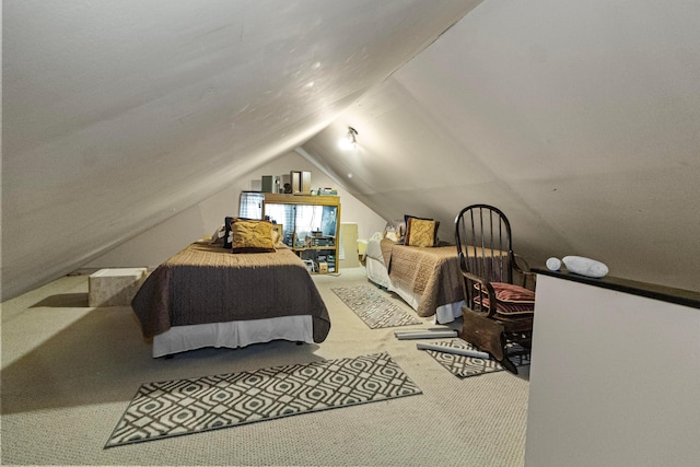 bedroom featuring carpet flooring and vaulted ceiling