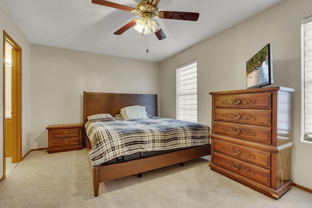 bedroom featuring a ceiling fan, carpet flooring, and baseboards