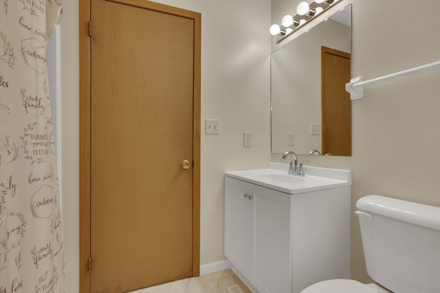 bathroom with vanity, toilet, and a shower with curtain