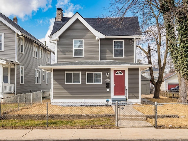 view of front of home featuring a fenced front yard, a gate, and roof with shingles