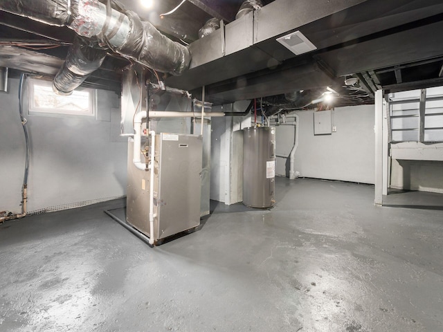 basement featuring water heater, visible vents, and heating unit