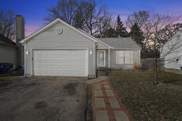 single story home with an attached garage and driveway