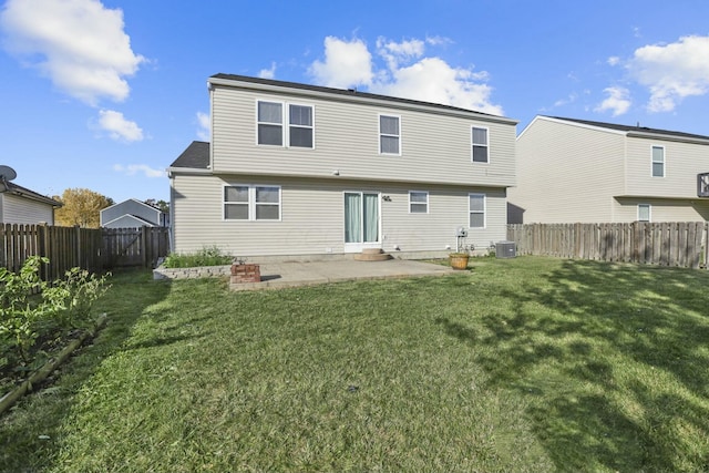 rear view of house with a lawn, a patio area, a fenced backyard, and central air condition unit