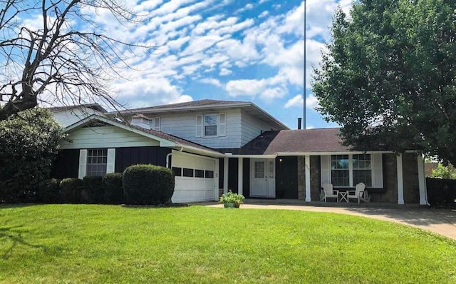 view of front of home featuring a garage and a front lawn