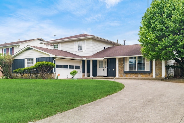 2715 Kenview Rd S, Columbus, OH 43209 - view of front of property featuring concrete driveway, a shingled roof, a front yard, and stone siding