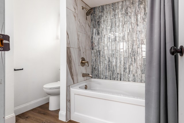 2715 Kenview Rd S, Columbus, OH 43209 - bathroom featuring toilet, shower / tub combo with curtain, wood finished floors, and baseboards
