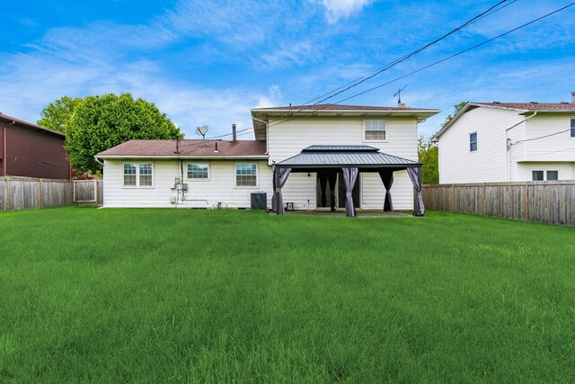 2715 Kenview Rd S, Columbus, OH 43209 - back of property featuring a yard, a gazebo, central AC unit, and a fenced backyard
