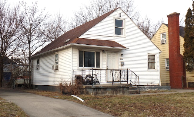 view of front facade featuring cooling unit