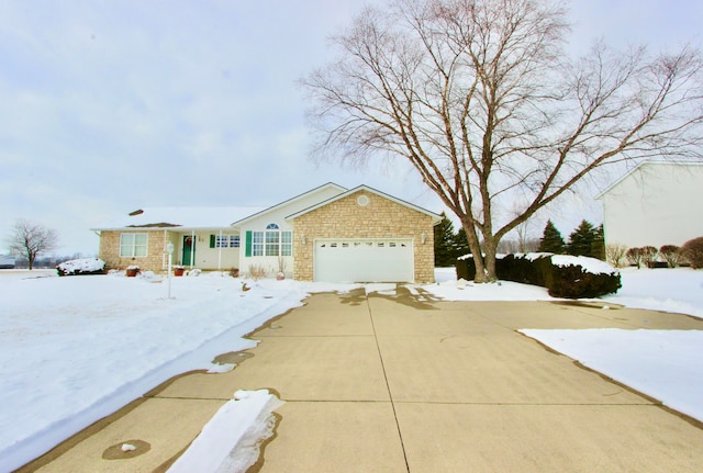 ranch-style home with a garage, concrete driveway, and stone siding