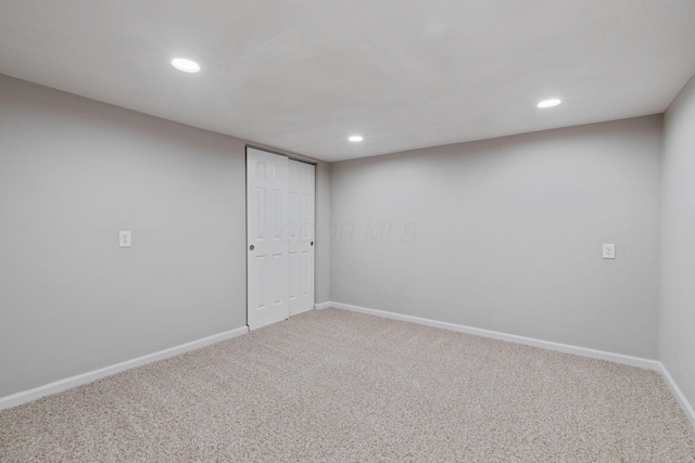 finished basement featuring carpet floors, recessed lighting, and baseboards