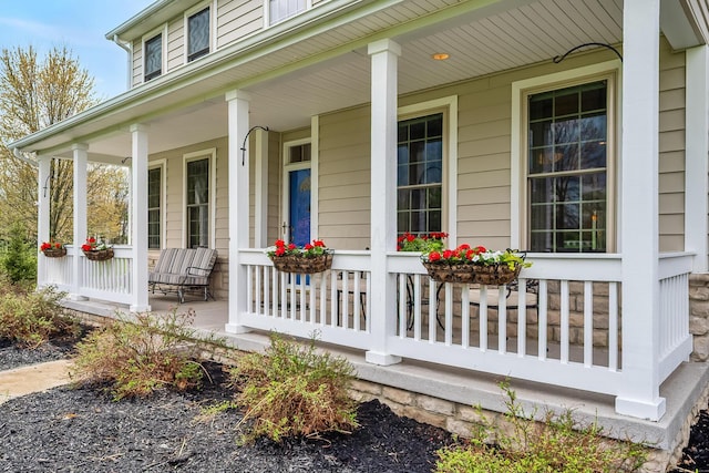 doorway to property with covered porch