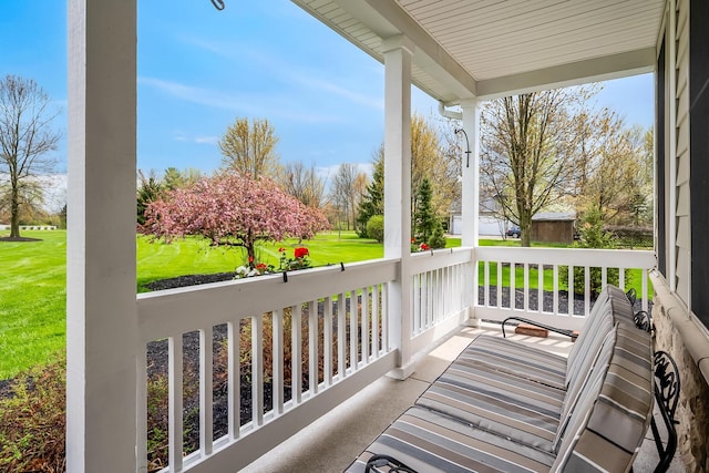 balcony featuring a porch