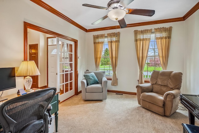 sitting room with a wealth of natural light, carpet flooring, ornamental molding, and visible vents