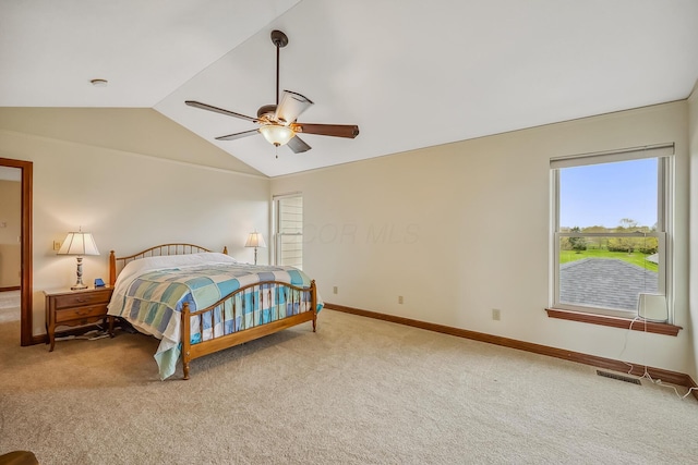 carpeted bedroom with vaulted ceiling, a ceiling fan, visible vents, and baseboards