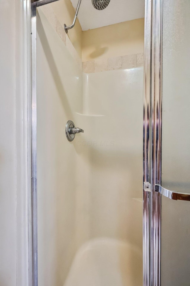 full bath featuring a stall shower
