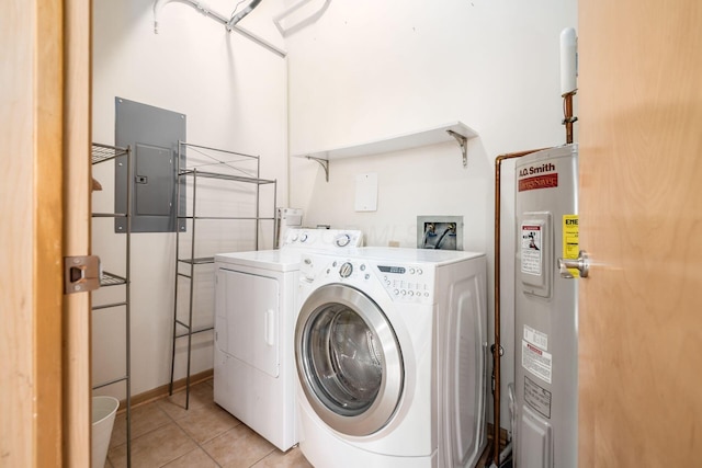 clothes washing area featuring laundry area, light tile patterned floors, electric panel, washing machine and dryer, and water heater