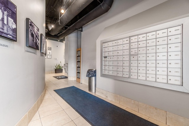 interior space featuring light tile patterned floors and baseboards