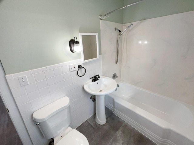 full bathroom featuring shower / bathing tub combination, tile walls, and toilet