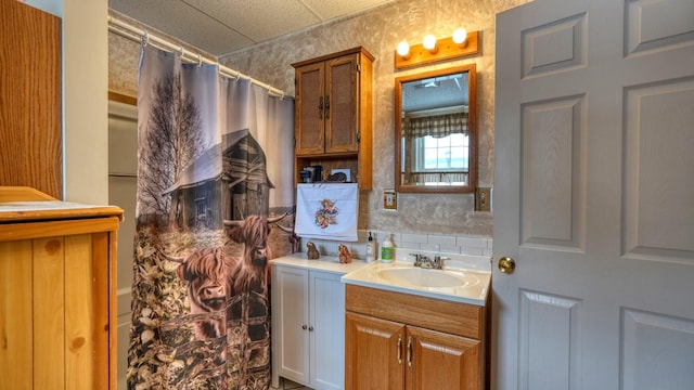 1295 Maple Brook Rd, New Concord, OH 43762 - bathroom featuring decorative backsplash and vanity