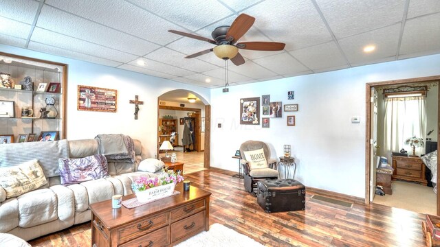 1295 Maple Brook Rd, New Concord, OH 43762 - living room featuring a paneled ceiling, arched walkways, light wood-style floors, and a ceiling fan