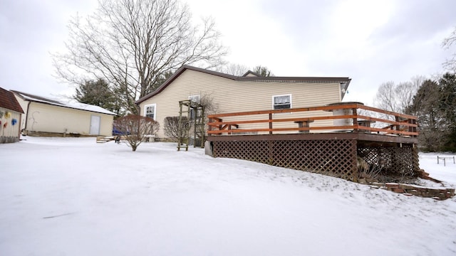 1295 Maple Brook Rd, New Concord, OH 43762 - snow covered property with an outbuilding and a deck
