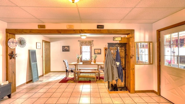 1295 Maple Brook Rd, New Concord, OH 43762 - dining room with a wealth of natural light, light tile patterned floors, and a paneled ceiling