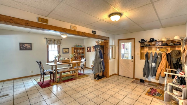1295 Maple Brook Rd, New Concord, OH 43762 - interior space with light tile patterned floors, a drop ceiling, and baseboards