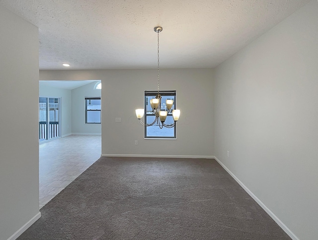1128 Legacy Ln, Pataskala, OH 43062 - unfurnished dining area with a chandelier, dark colored carpet, a textured ceiling, and recessed lighting