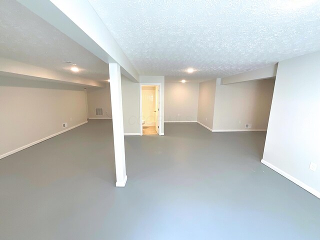 1128 Legacy Ln, Pataskala, OH 43062 - finished basement featuring a textured ceiling and recessed lighting