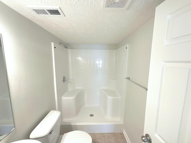 1128 Legacy Ln, Pataskala, OH 43062 - full bath featuring a textured ceiling and a shower