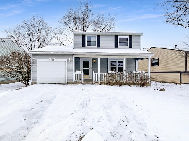 traditional-style house with an attached garage and a porch