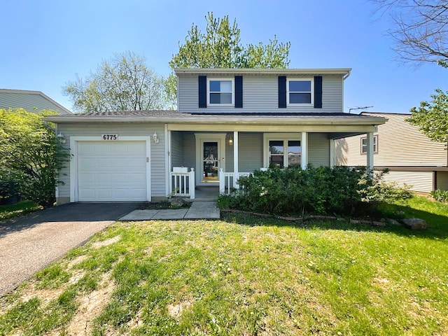 traditional home featuring a front yard, a garage, covered porch, and aphalt driveway