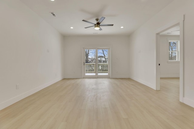 spare room featuring light wood-style flooring, recessed lighting, visible vents, and baseboards