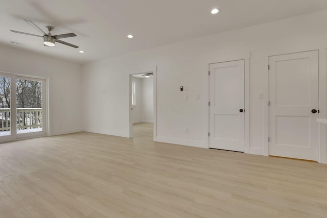 spare room featuring light wood-style floors, baseboards, a ceiling fan, and recessed lighting