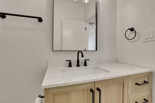 bathroom with visible vents and vanity