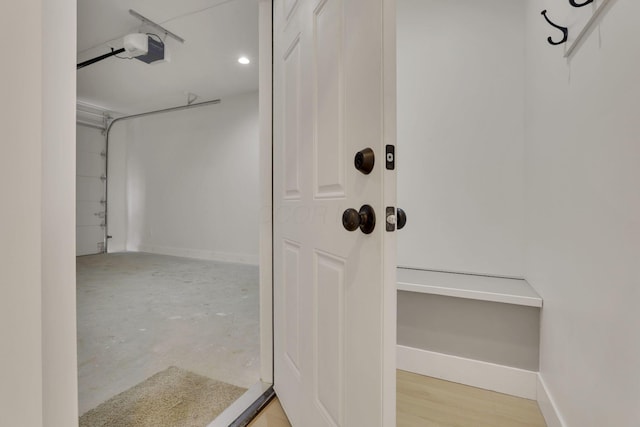 bathroom with concrete floors and baseboards