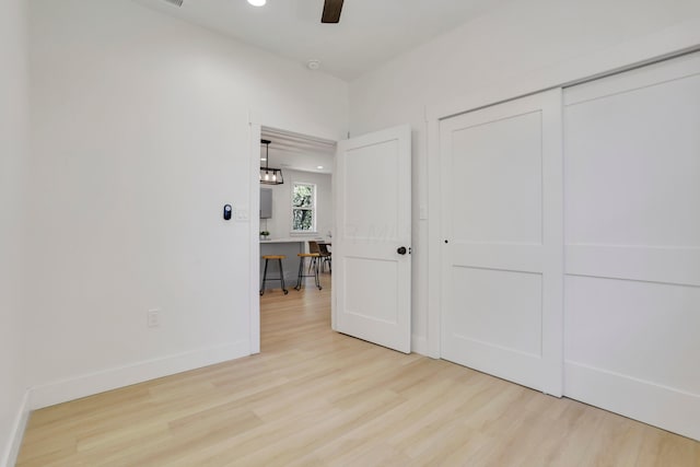 344 Buckingham St, Newark, OH 43055 - unfurnished bedroom with wood finished floors, baseboards, a closet, and a ceiling fan