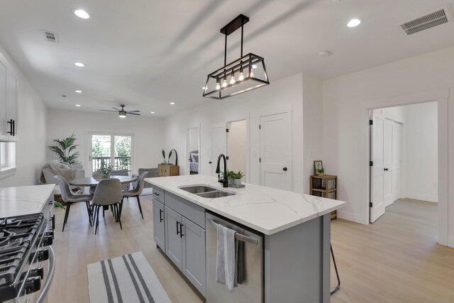 344 Buckingham St, Newark, OH 43055 - kitchen with gray cabinetry, a sink, light wood finished floors, appliances with stainless steel finishes, and recessed lighting
