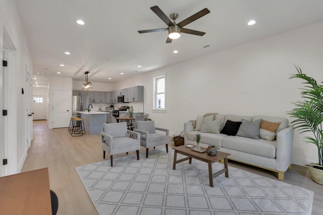 344 Buckingham St, Newark, OH 43055 - living area with ceiling fan, recessed lighting, light wood-type flooring, and baseboards