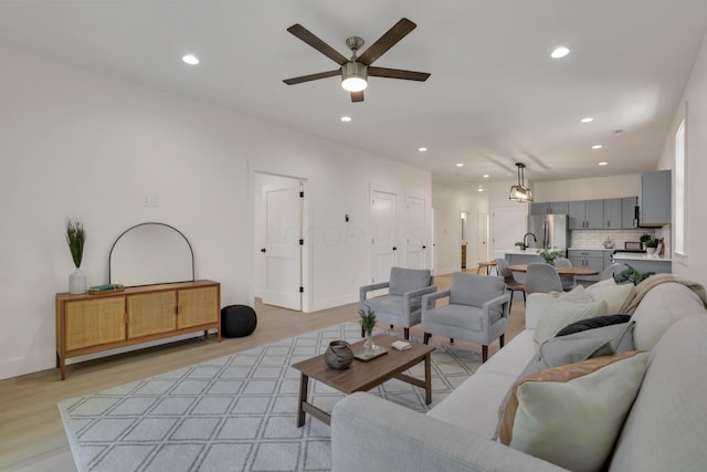 344 Buckingham St, Newark, OH 43055 - living room featuring recessed lighting, a ceiling fan, light wood finished floors, and baseboards