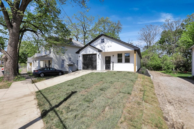 344 Buckingham St, Newark, OH 43055 - view of front of property with driveway, an attached garage, and a front lawn